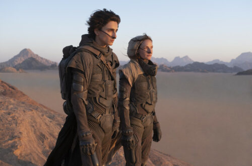 Dune: Part One : Lady Jessica and Paul stand on a hill in the desert